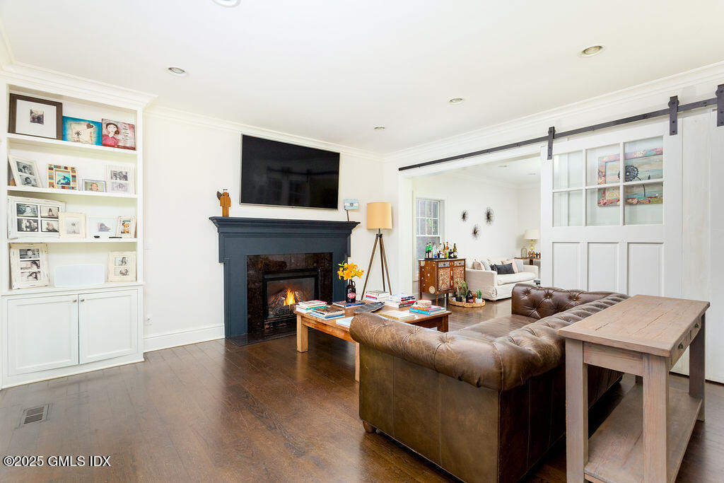 3 Elizabeth Lane Riverside, CT 06878 - Photo 10 of 39 a living room with furniture and a fireplace
