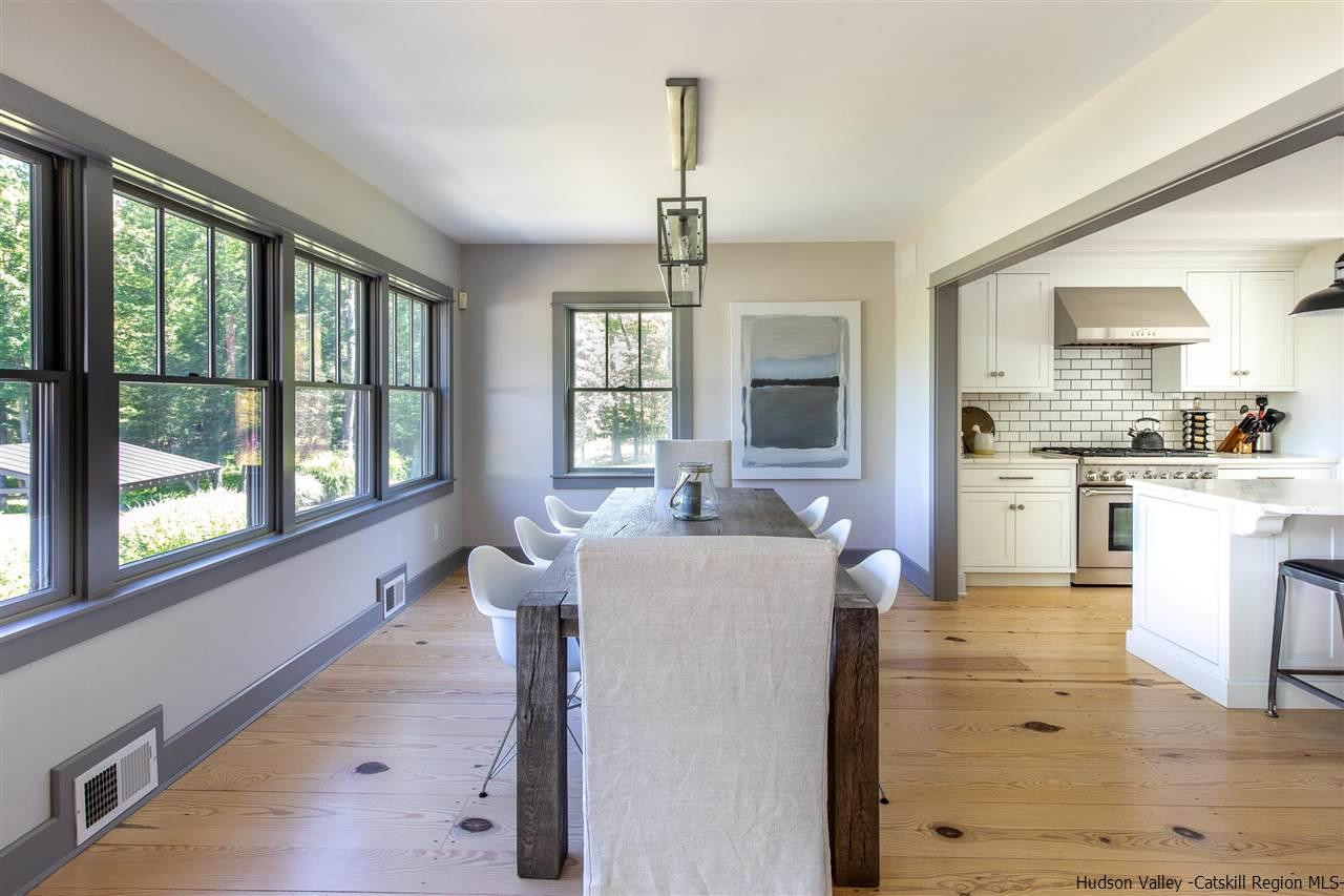 311 Buck Road Stone Ridge, NY 12484 - Photo 11 of 35 a living room with furniture and a large window