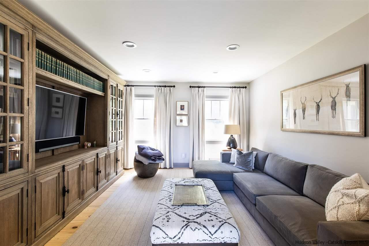 311 Buck Road Stone Ridge, NY 12484 - Photo 17 of 35 a living room with furniture and a flat screen tv