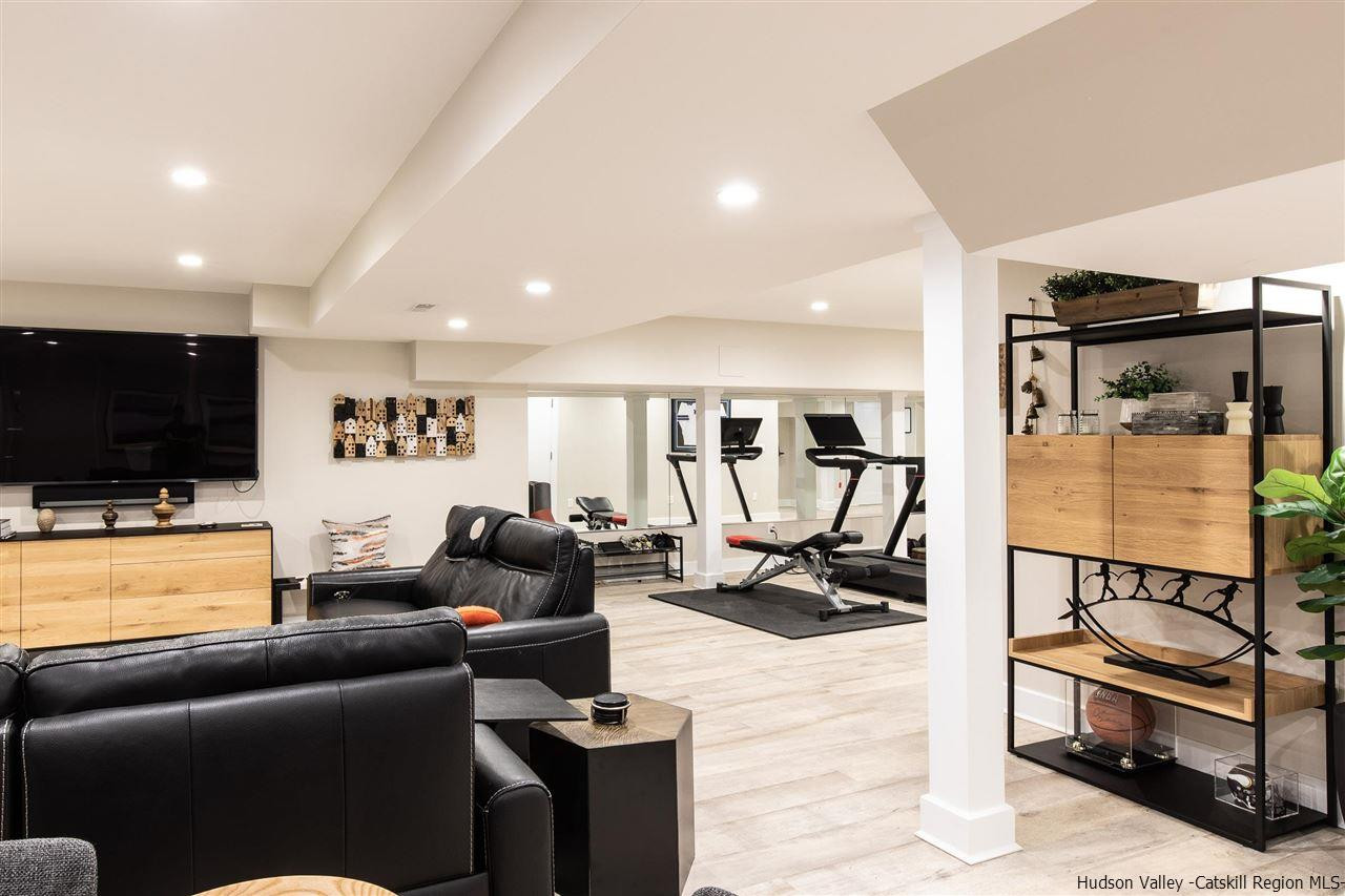 311 Buck Road Stone Ridge, NY 12484 - Photo 27 of 35 a living room with furniture and a flat screen tv
