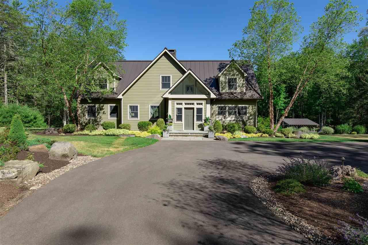 311 Buck Road Stone Ridge, NY 12484 - Photo 5 of 35 a front view of a house with garden