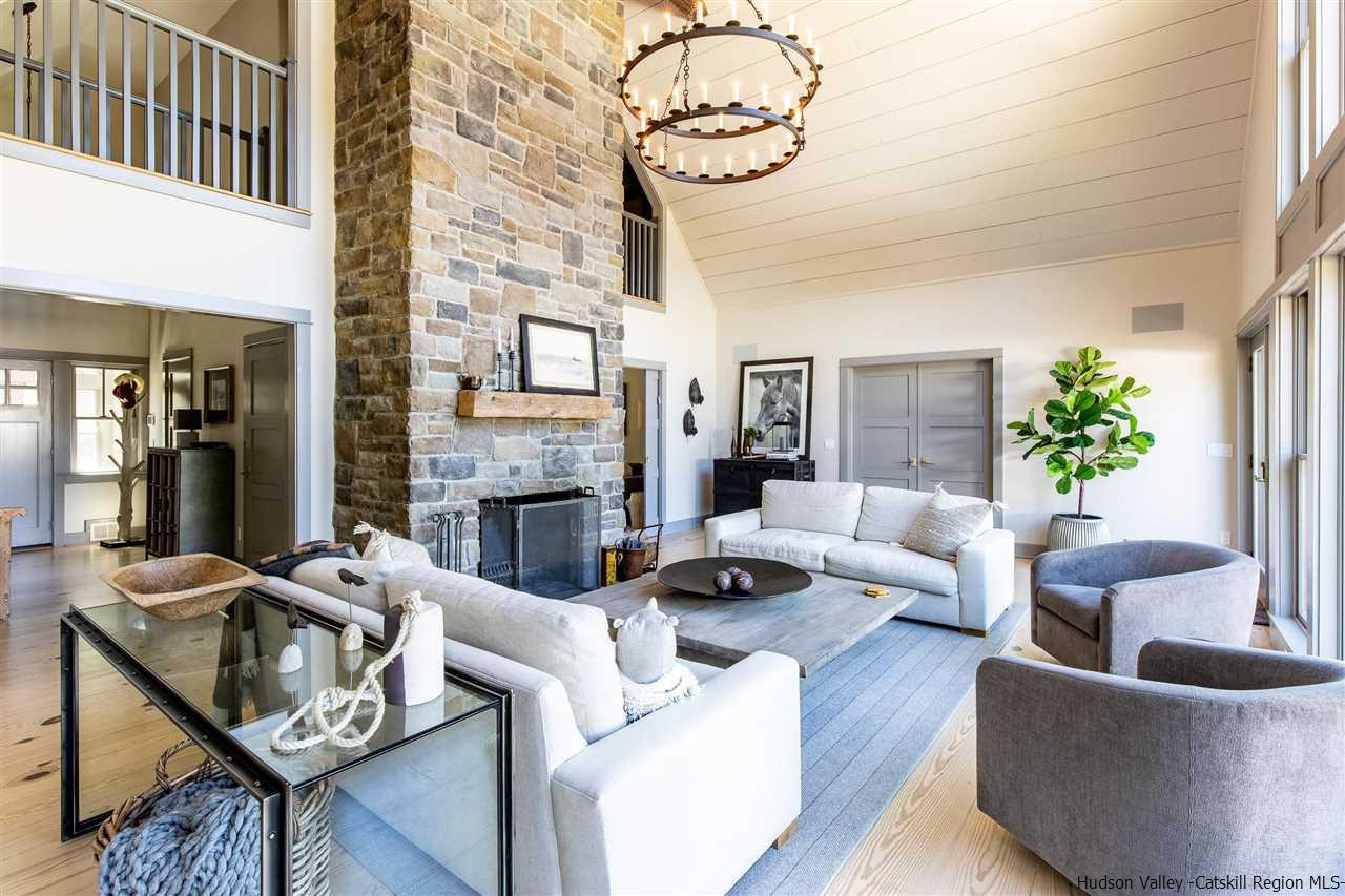 311 Buck Road Stone Ridge, NY 12484 - Photo 7 of 35 a living room with furniture and a fireplace