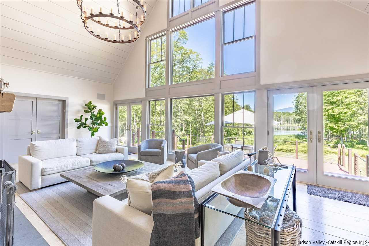 311 Buck Road Stone Ridge, NY 12484 - Photo 8 of 35 a living room with furniture and a large window