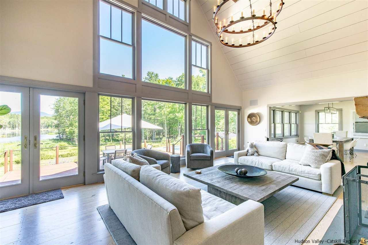 311 Buck Road Stone Ridge, NY 12484 - Photo 9 of 35 a living room with furniture and a large window