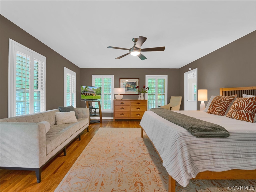 22341 Skinquarter Road Moseley, VA 23120 - Photo 11 of 50 a spacious bedroom with a large bed and a large window