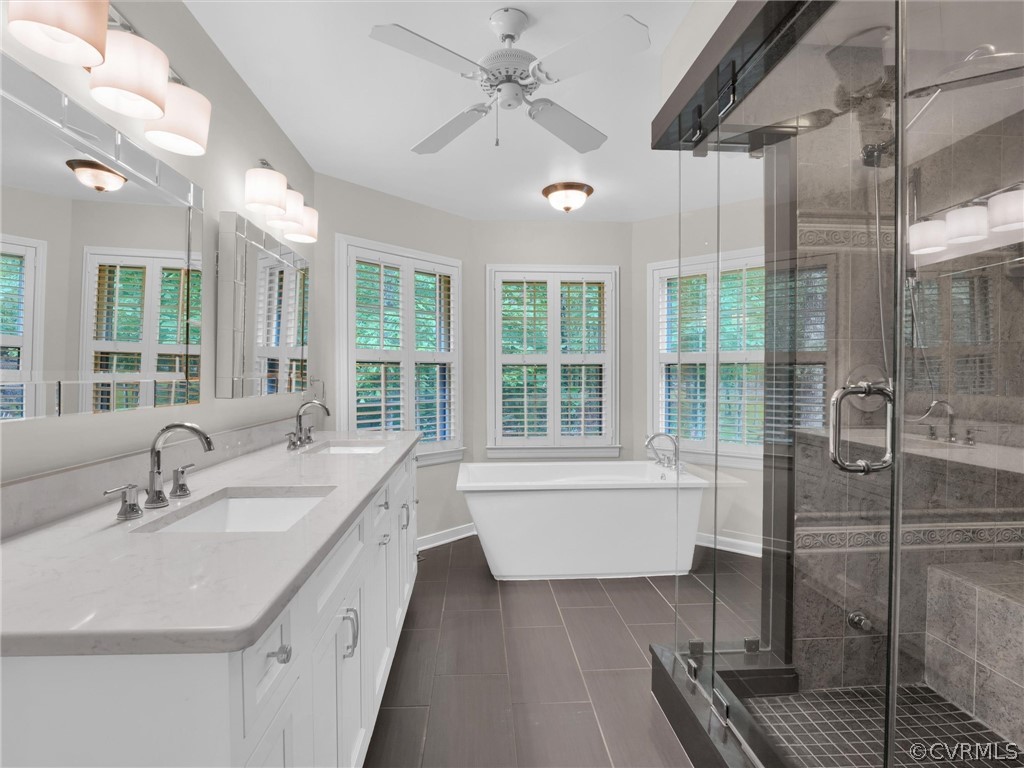 22341 Skinquarter Road Moseley, VA 23120 - Photo 16 of 50 a bathroom with a tub sink and shower