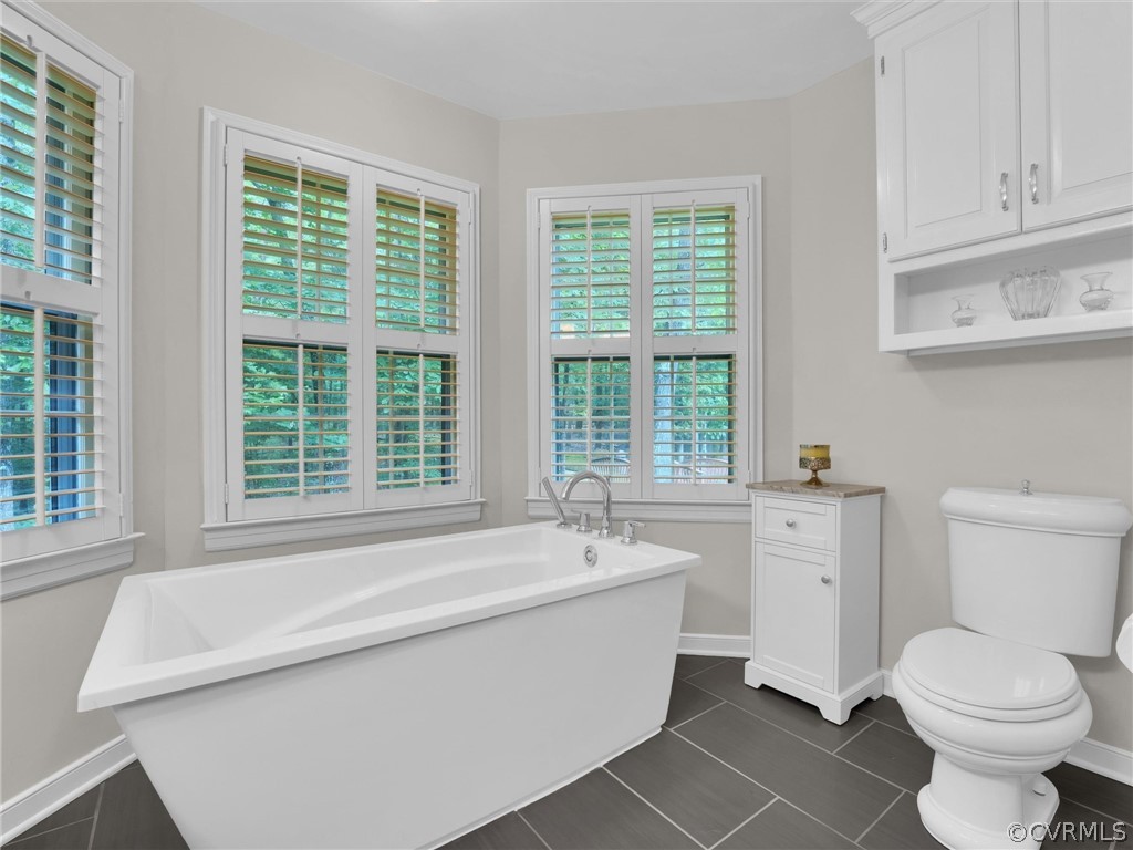 22341 Skinquarter Road Moseley, VA 23120 - Photo 17 of 50 a bathroom with a sink and a bathtub