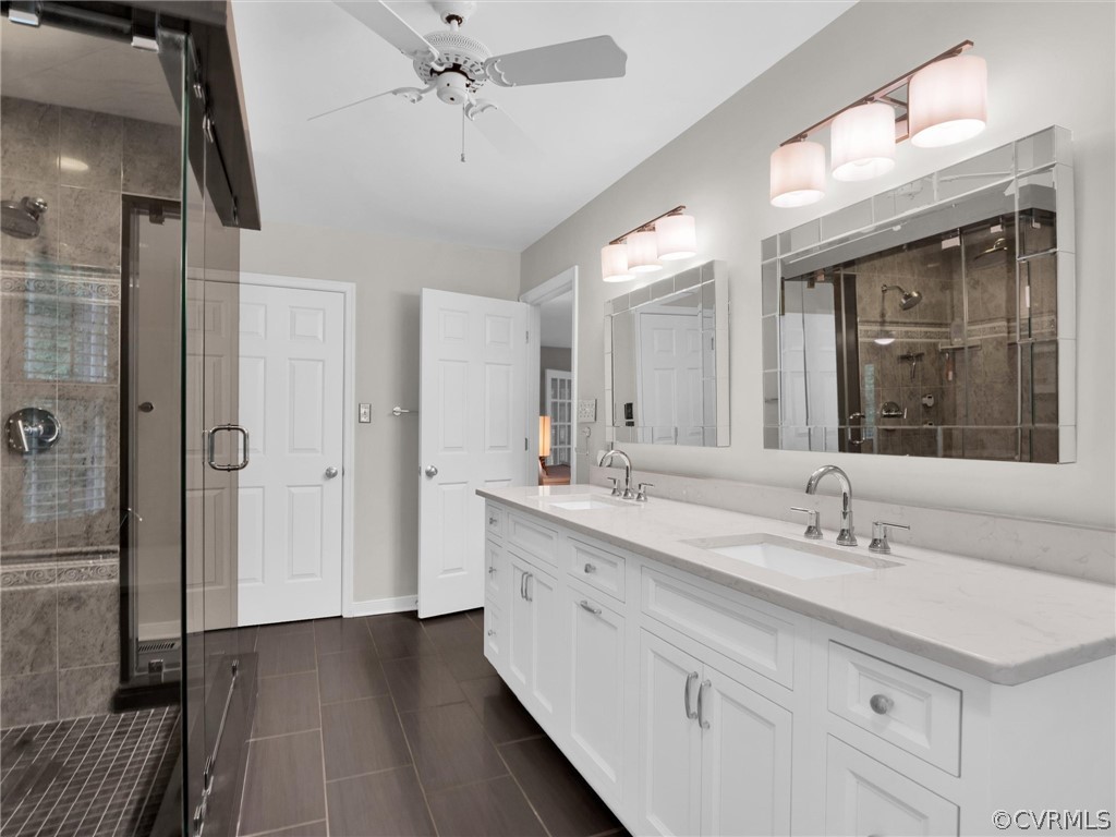 22341 Skinquarter Road Moseley, VA 23120 - Photo 18 of 50 a spacious bathroom with a double vanity sink mirror and shower