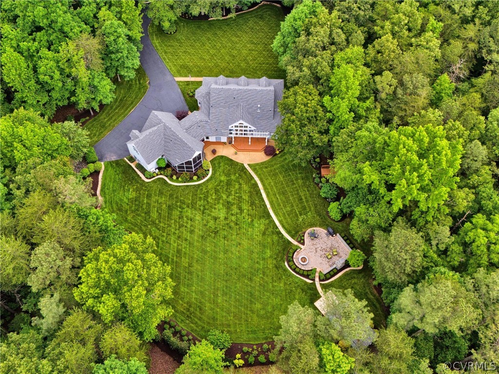 22341 Skinquarter Road Moseley, VA 23120 - Photo 2 of 50 an aerial view of a house with a garden and trees