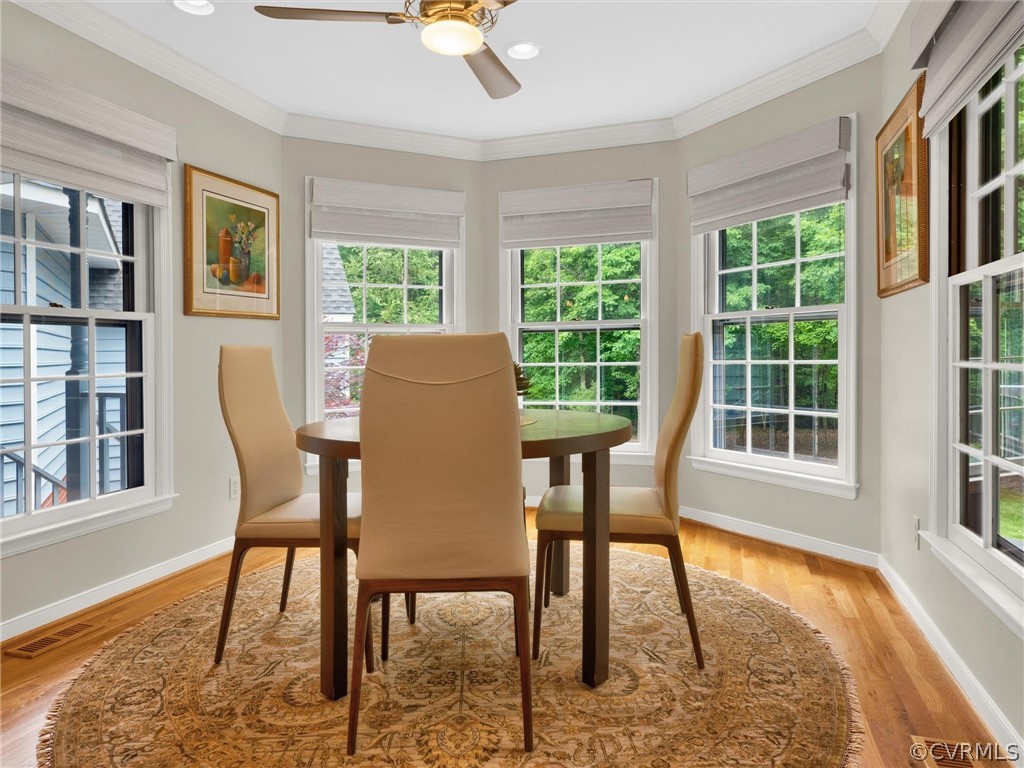 22341 Skinquarter Road Moseley, VA 23120 - Photo 22 of 50 a dining room with furniture a rug and wooden floor