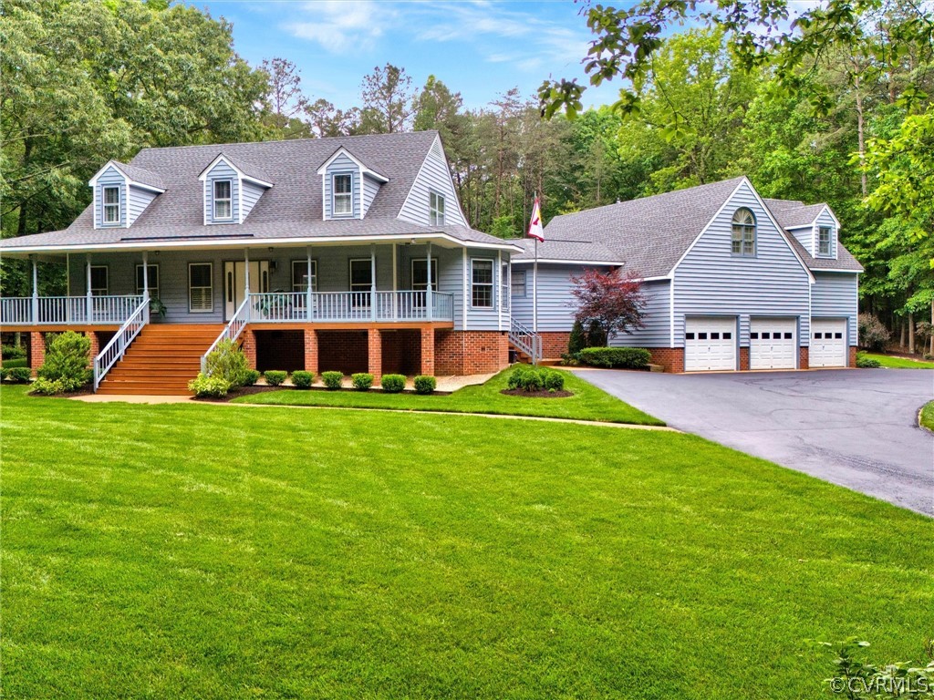 22341 Skinquarter Road Moseley, VA 23120 - Photo 3 of 50 a front view of a house with a yard and trees