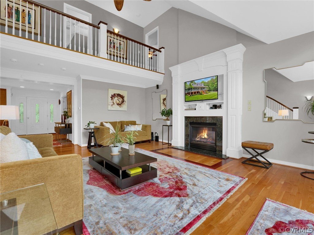 22341 Skinquarter Road Moseley, VA 23120 - Photo 32 of 50 a living room with furniture rug and a fireplace