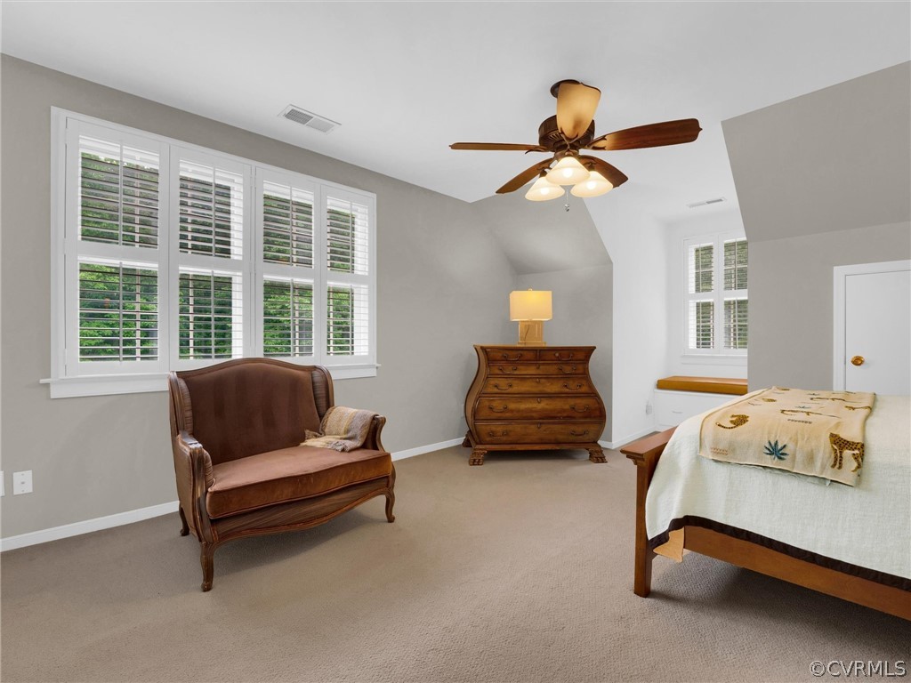 22341 Skinquarter Road Moseley, VA 23120 - Photo 35 of 50 a bedroom with a bed and a chandelier