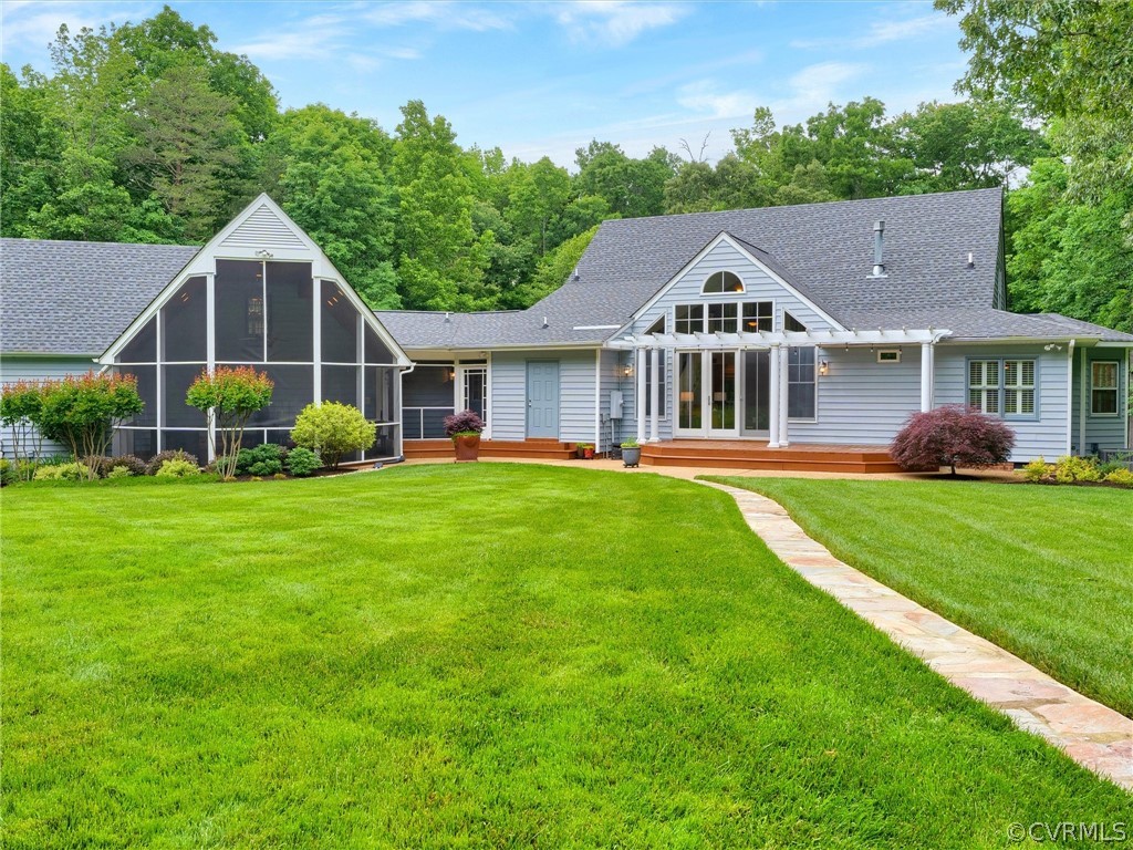 22341 Skinquarter Road Moseley, VA 23120 - Photo 5 of 50 a front view of a house with a yard and potted plants