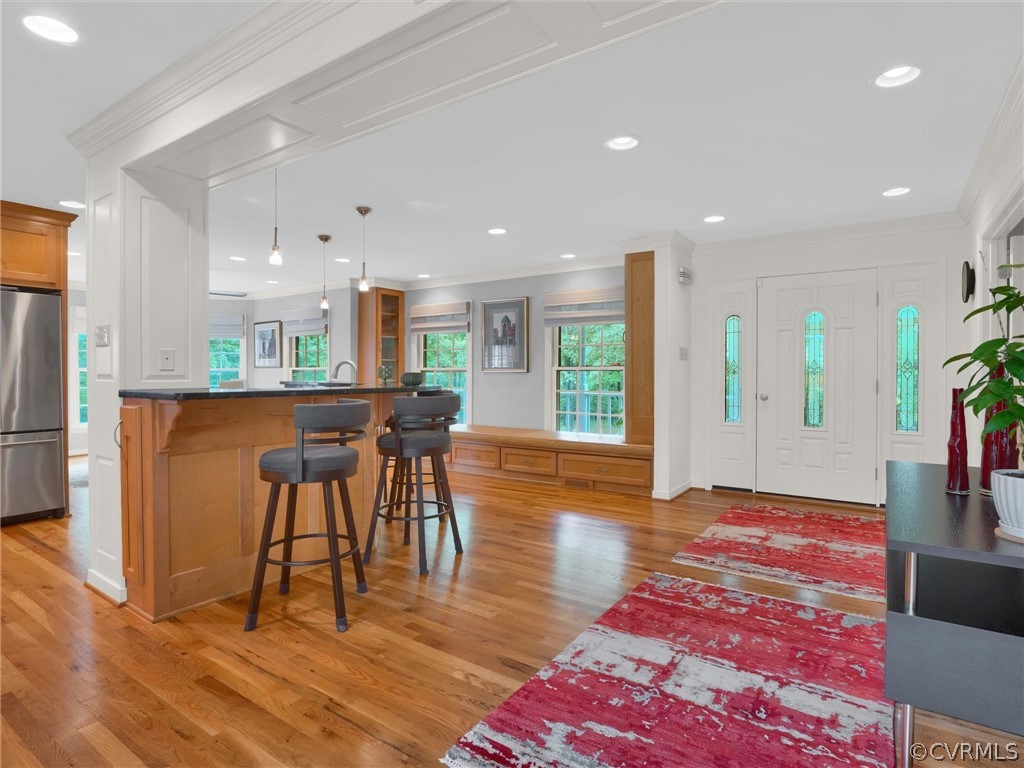 22341 Skinquarter Road Moseley, VA 23120 - Photo 10 of 50 a view of a kitchen with kitchen island dining table and wooden floor