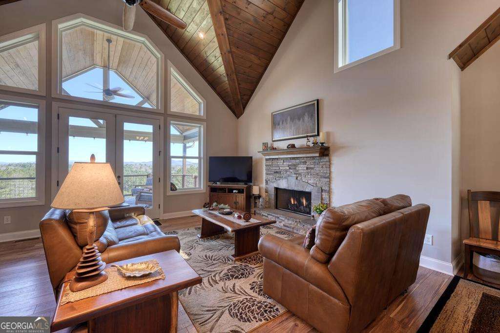 1309 Ridge Pointe Way, Unit 284 Blairsville, GA 30512 - Photo 12 of 75 a living room with furniture a fireplace and a large window