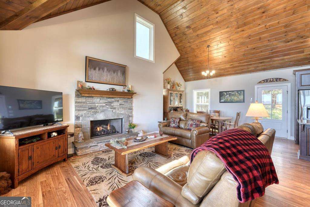 1309 Ridge Pointe Way, Unit 284 Blairsville, GA 30512 - Photo 13 of 75 a living room with furniture a flat screen tv and a fireplace