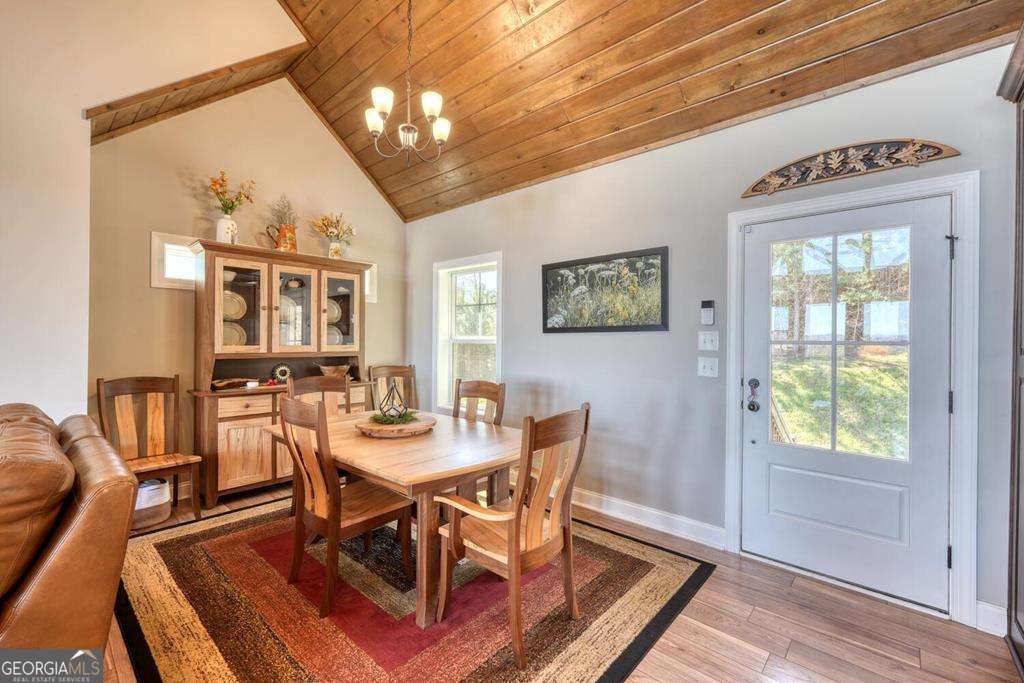 1309 Ridge Pointe Way, Unit 284 Blairsville, GA 30512 - Photo 16 of 75 a view of a dining room with furniture window and wooden floor