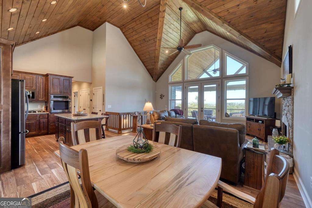 1309 Ridge Pointe Way, Unit 284 Blairsville, GA 30512 - Photo 17 of 75 a view of a dining room with furniture a kitchen and chandelier