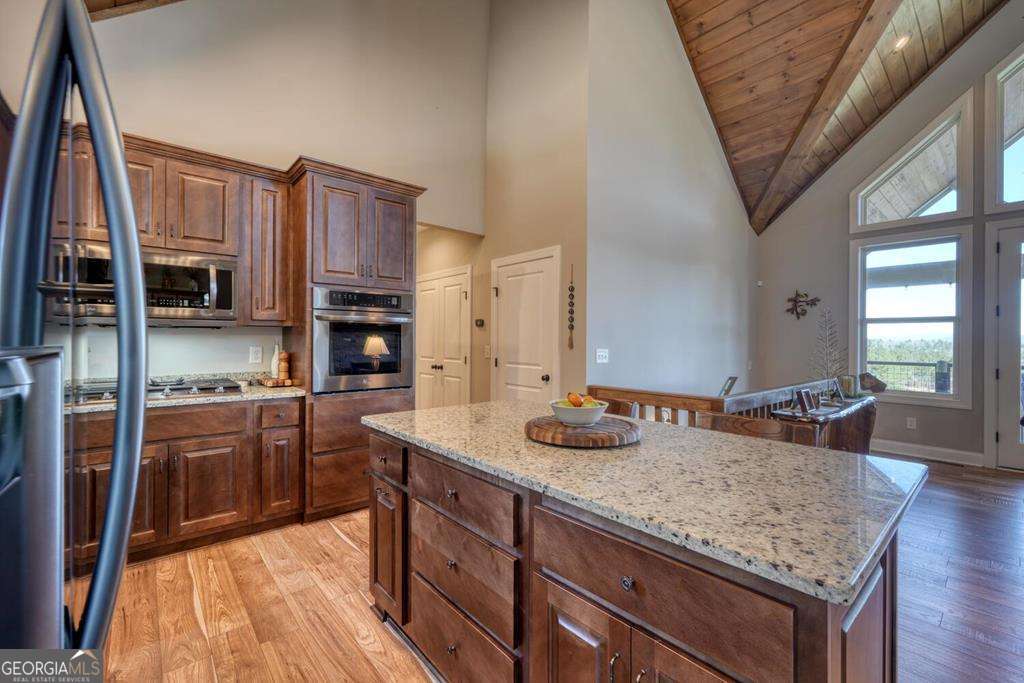 1309 Ridge Pointe Way, Unit 284 Blairsville, GA 30512 - Photo 19 of 75 a kitchen with stainless steel appliances granite countertop a sink stove and refrigerator