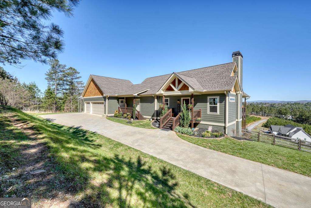 1309 Ridge Pointe Way, Unit 284 Blairsville, GA 30512 - Photo 2 of 75 a front view of a house with yard patio and green space