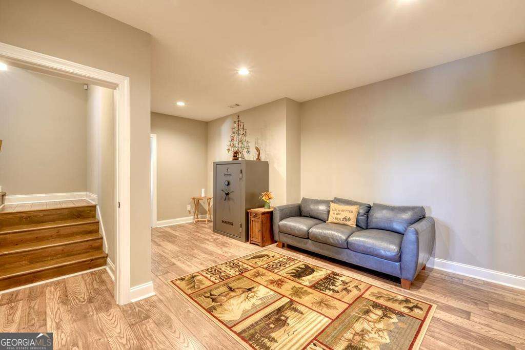 1309 Ridge Pointe Way, Unit 284 Blairsville, GA 30512 - Photo 33 of 75 a living room with furniture and a rug