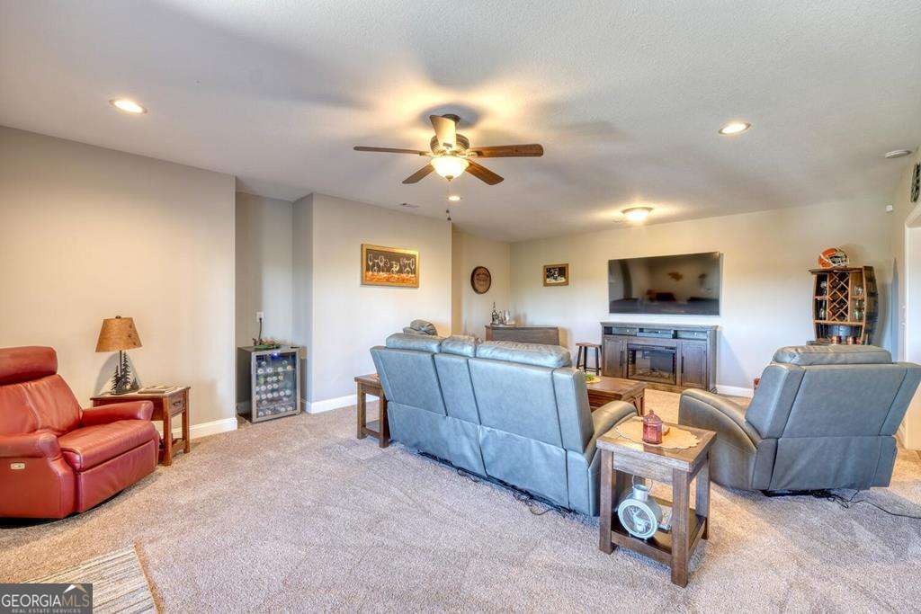 1309 Ridge Pointe Way, Unit 284 Blairsville, GA 30512 - Photo 37 of 75 a living room with furniture and a flat screen tv
