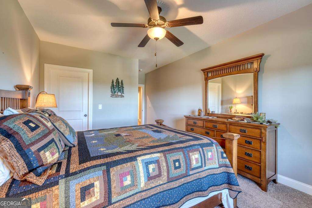 1309 Ridge Pointe Way, Unit 284 Blairsville, GA 30512 - Photo 39 of 75 a bedroom with a bed and dresser