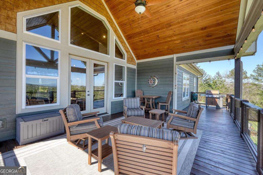 1309 Ridge Pointe Way, Unit 284 Blairsville, GA 30512 - Photo 44 of 75 a outdoor space with patio the couches and a dining table with the view of the balcony