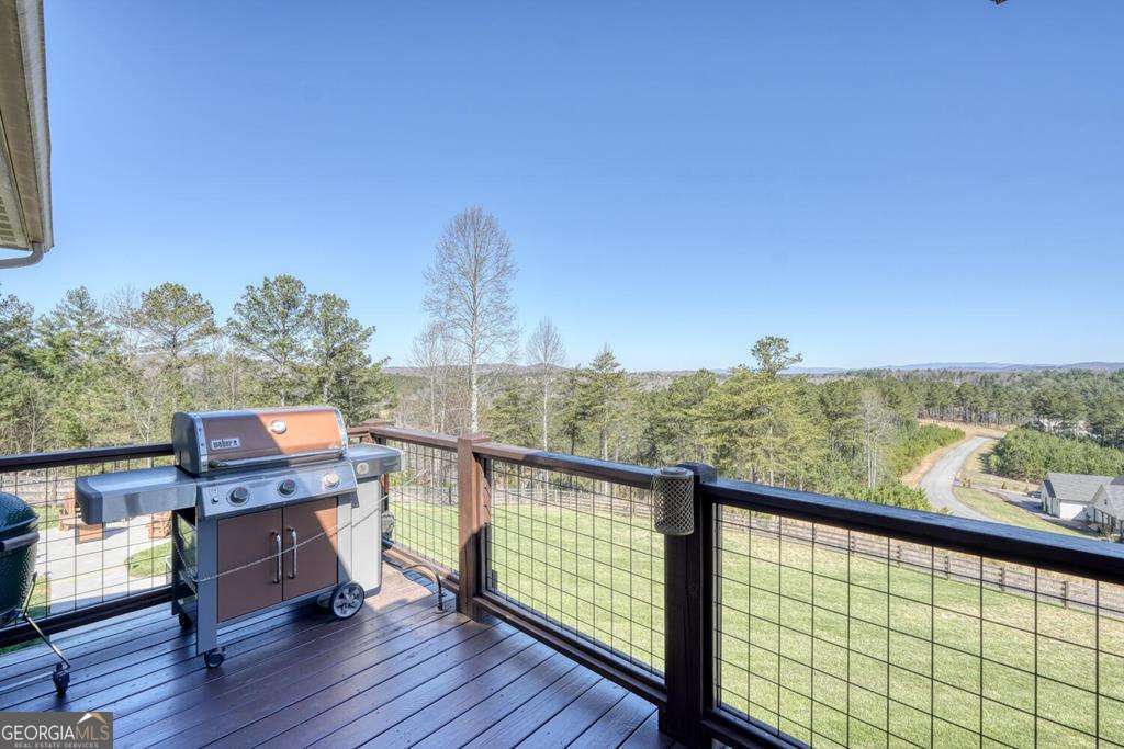 1309 Ridge Pointe Way, Unit 284 Blairsville, GA 30512 - Photo 46 of 75 a view of a balcony with wooden floor and outdoor seating