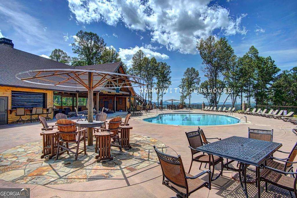 1309 Ridge Pointe Way, Unit 284 Blairsville, GA 30512 - Photo 70 of 75 a view of a swimming pool with sitting area