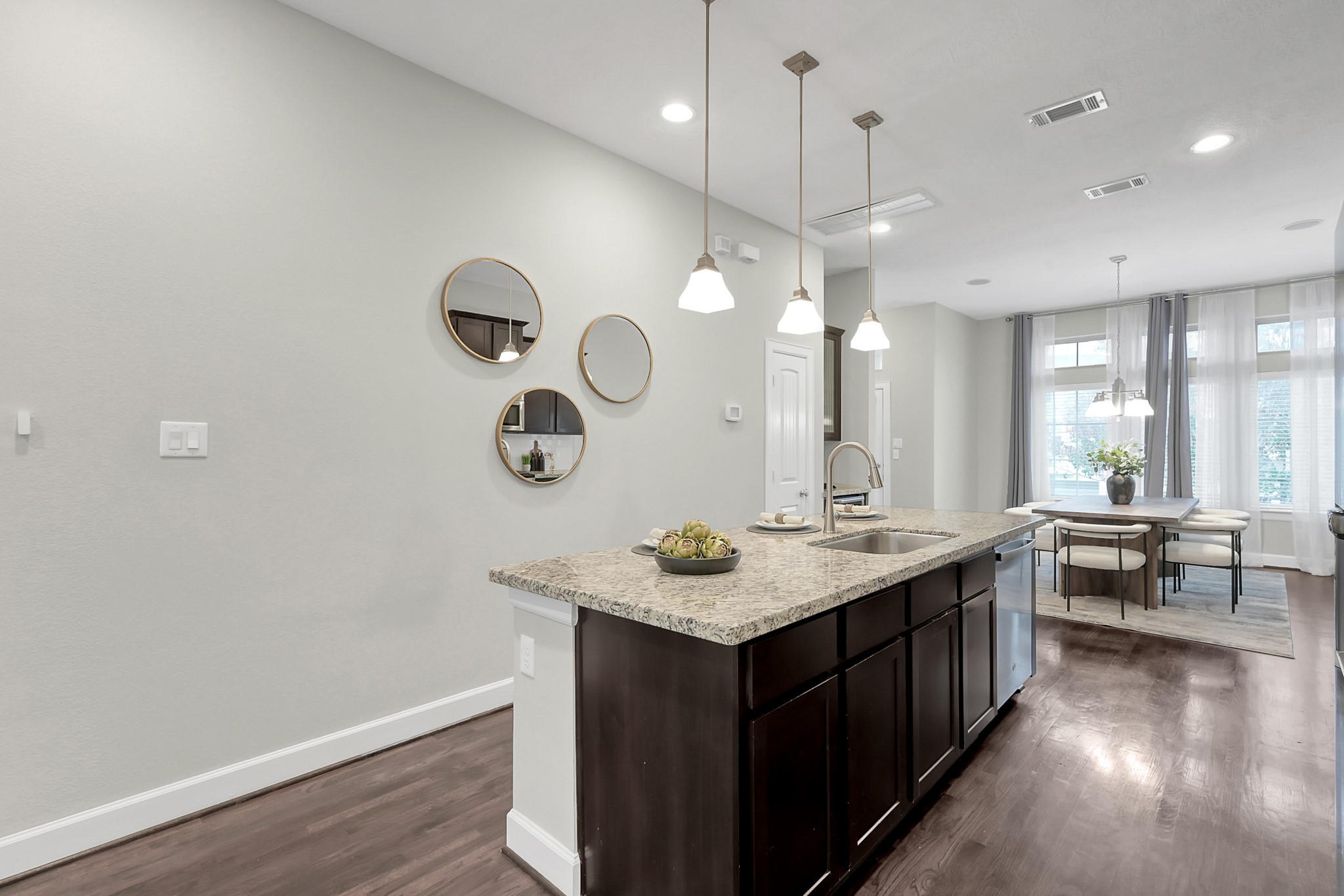 351 West 26th Street Houston, TX 77008 - Photo 16 of 45 The open layout flows into a dining area with large windows, providing plenty of natural light.