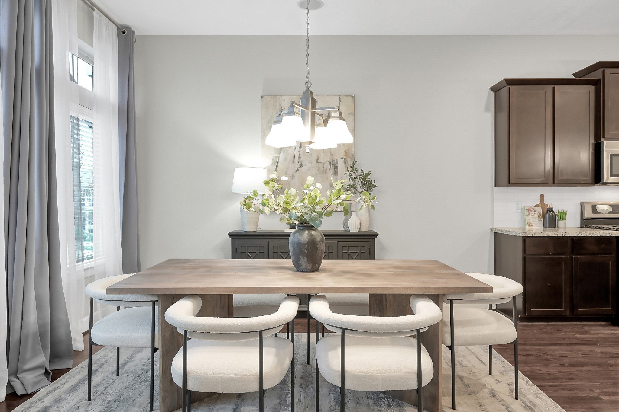 351 West 26th Street Houston, TX 77008 - Photo 22 of 45 Modern dining area with a stylish light fixture and easy access to the kitche