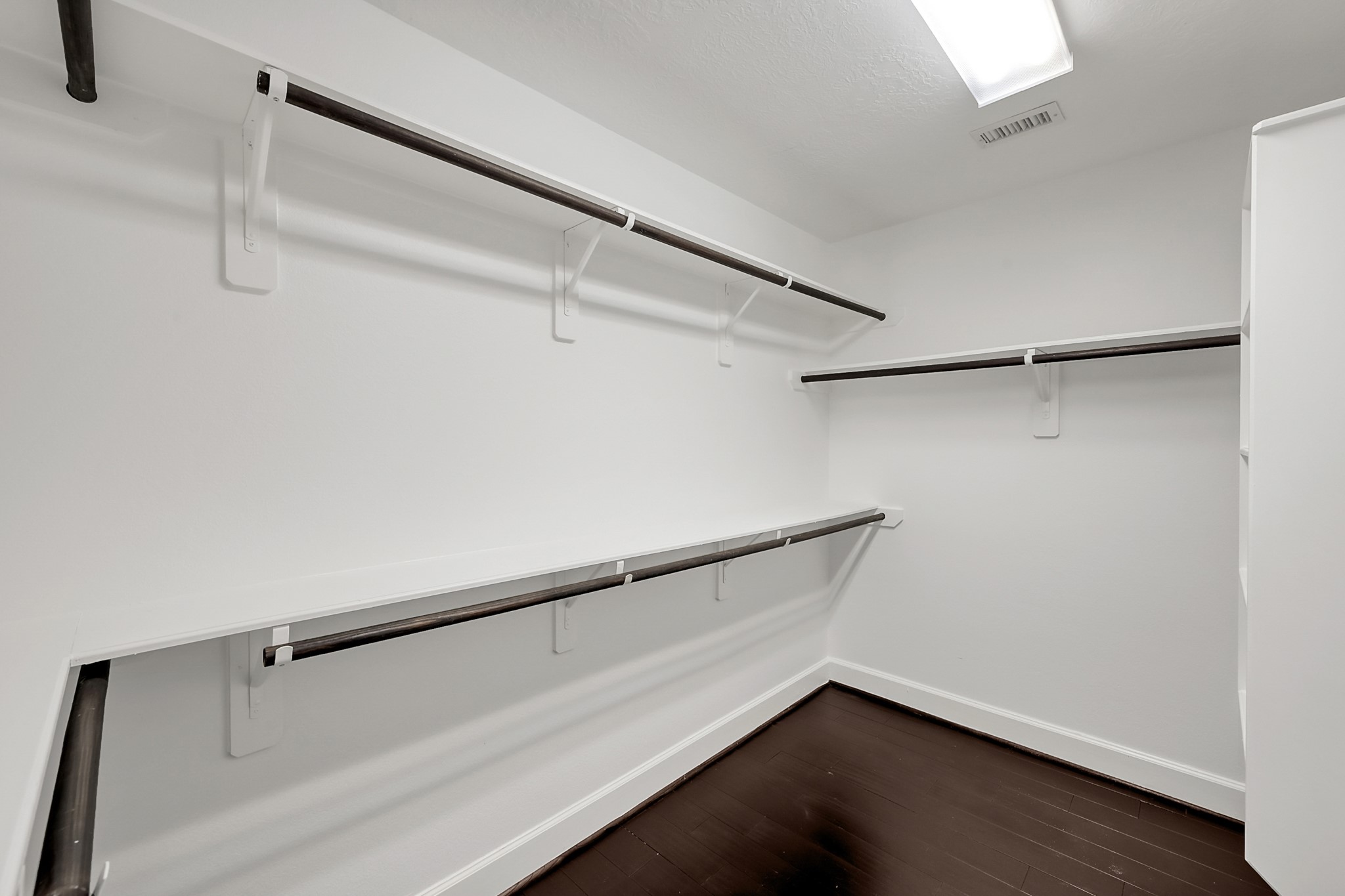 351 West 26th Street Houston, TX 77008 - Photo 29 of 45 Discover the ultimate in organization with this spacious walk-in closet, featuring sleek shelving and ample hanging space to keep your wardrobe beautifully arranged.
