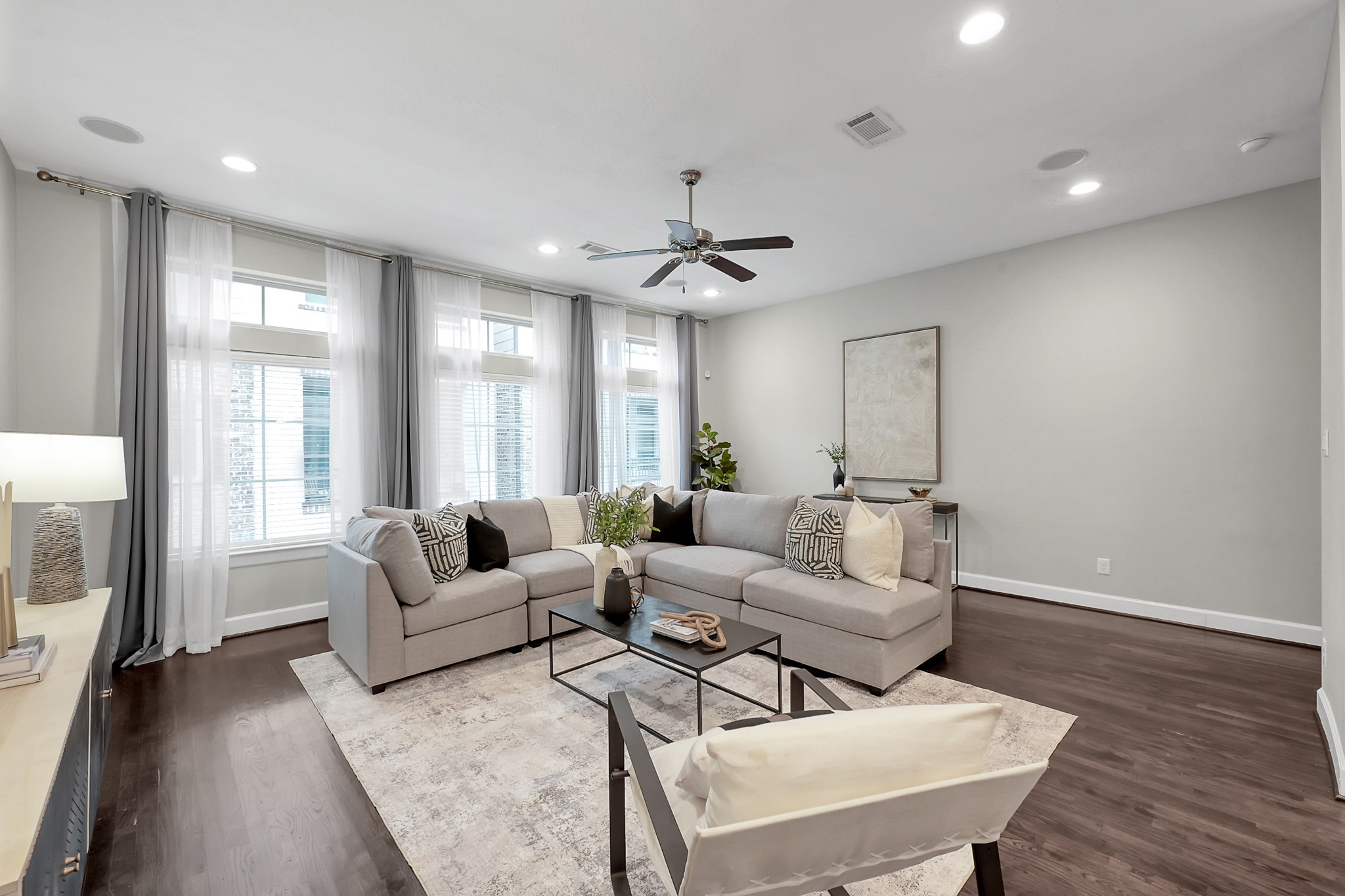 351 West 26th Street Houston, TX 77008 - Photo 9 of 45 Bright living room with large windows and elegant lighting—perfect for relaxation and entertaining.