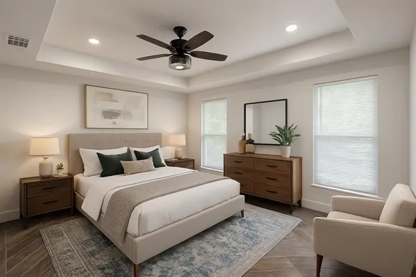 an empty room with a window and a fan