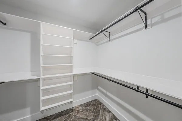 a bathroom with a shower and a sink