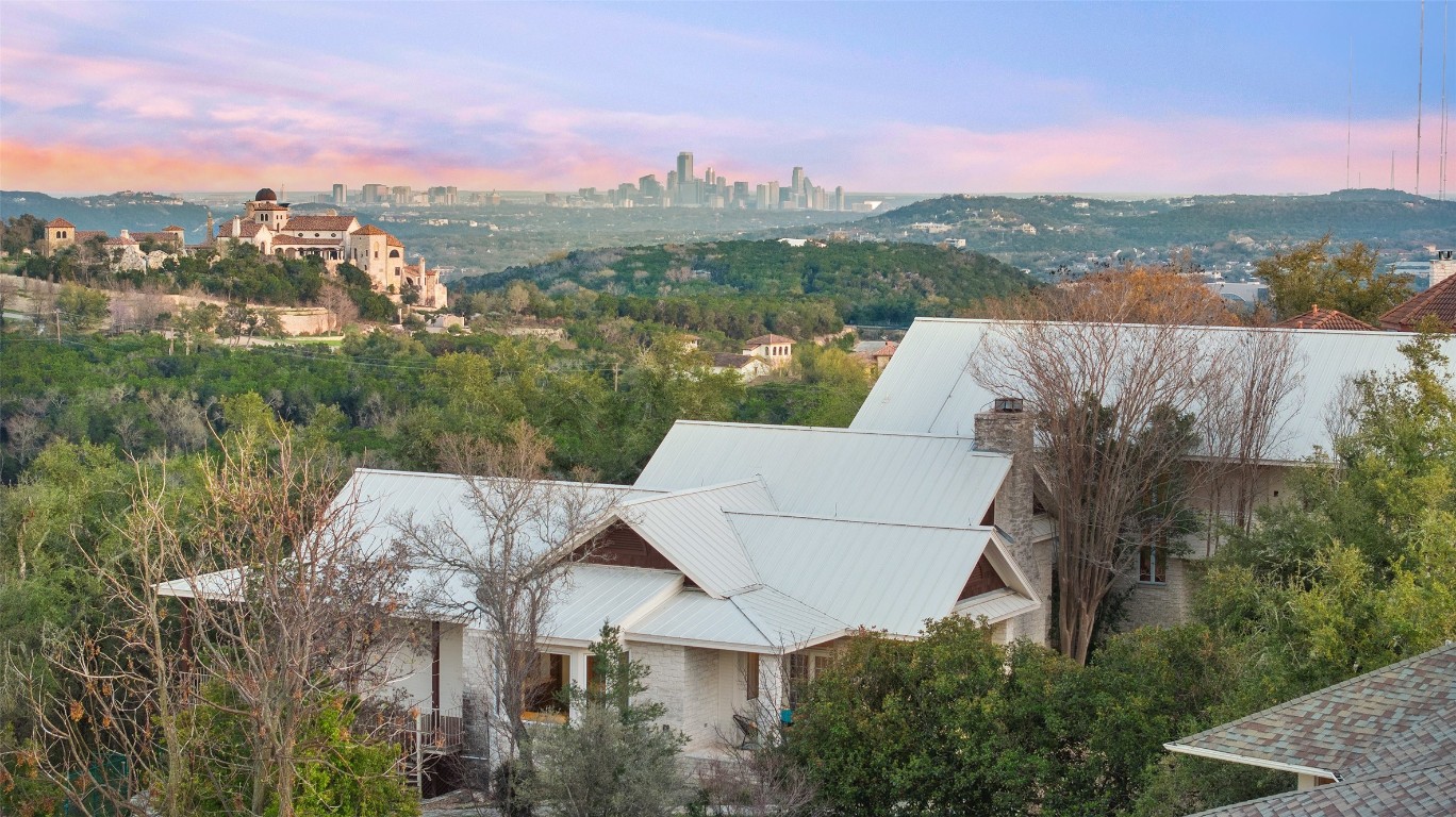 8003 Two Coves Drive Austin, TX 78730 - Photo 1 of 1 an aerial view of a house with a yard and lake view