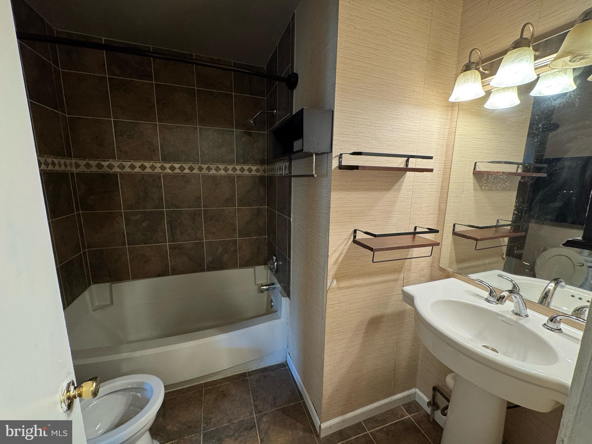 6113 Hil-Mar Drive District Heights, MD 20747 - Photo 14 of 15 a bathroom with a sink a toilet and shower