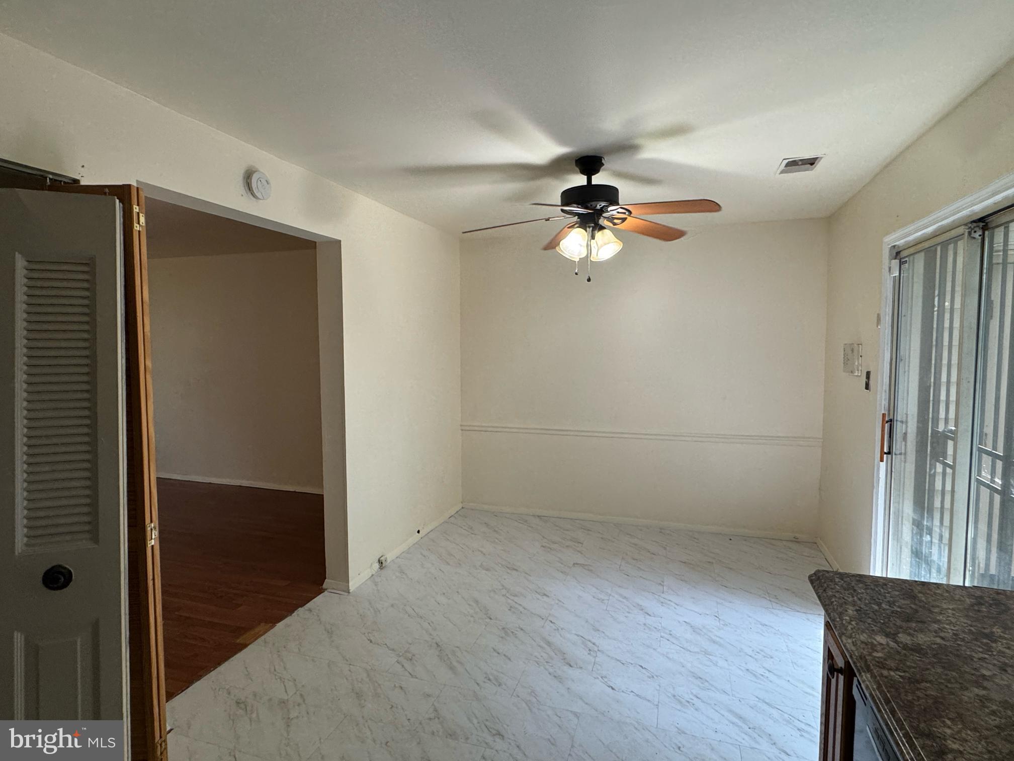 6113 Hil-Mar Drive District Heights, MD 20747 - Photo 6 of 15 wooden floor in an empty room with a window