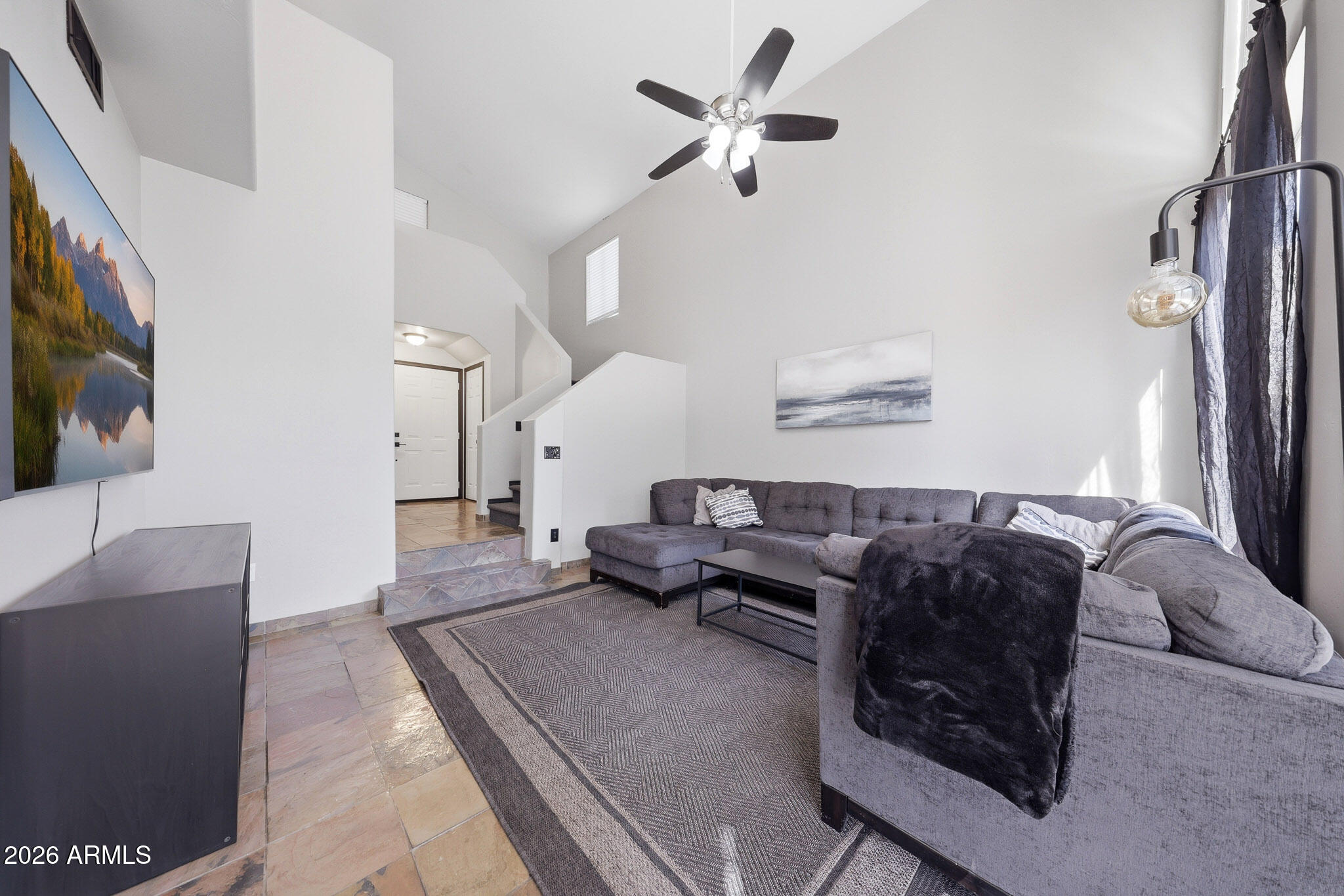 2167 East Nighthawk Way Phoenix, AZ 85048 - Photo 14 of 28 a living room with furniture and a flat screen tv