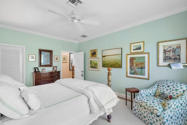 a bedroom with a bed and dresser