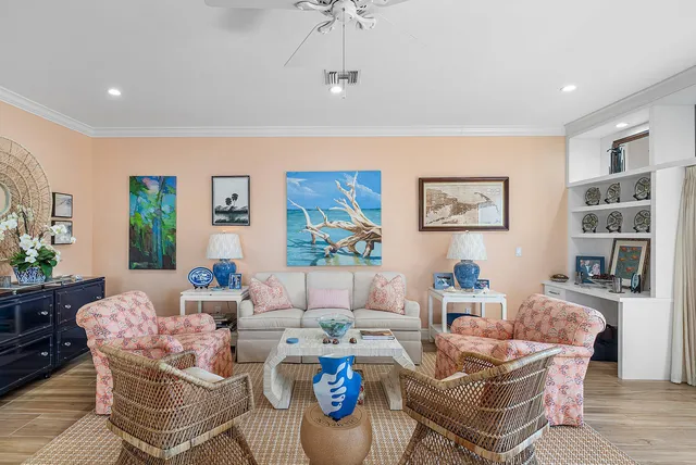 a living room with fireplace furniture and decor