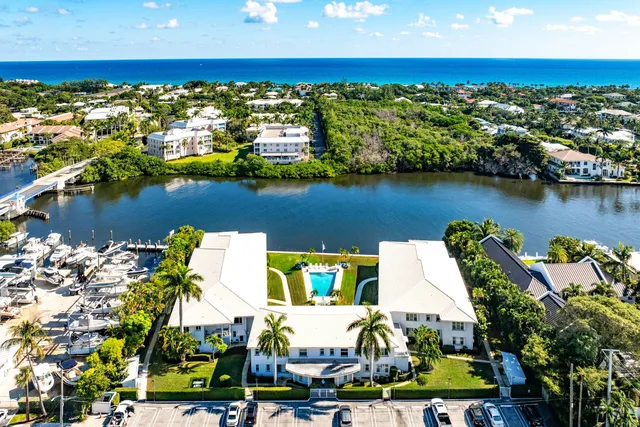 an aerial view of houses with yard