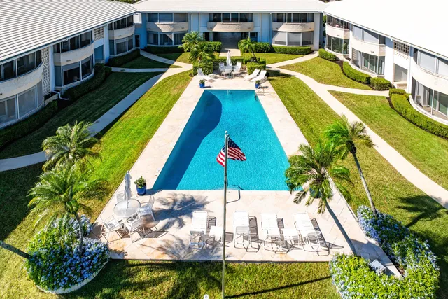 a view of a swimming pool with a chairs