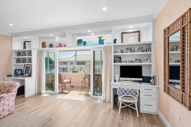 a view of a livingroom with furniture flat screen tv and staircase