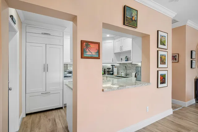 a view of kitchen with wooden floor