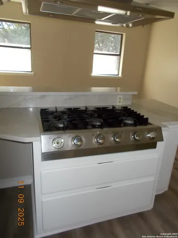 a close view of stove top oven and outdoor seating