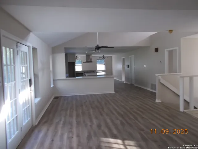a view of a room with a table and chairs