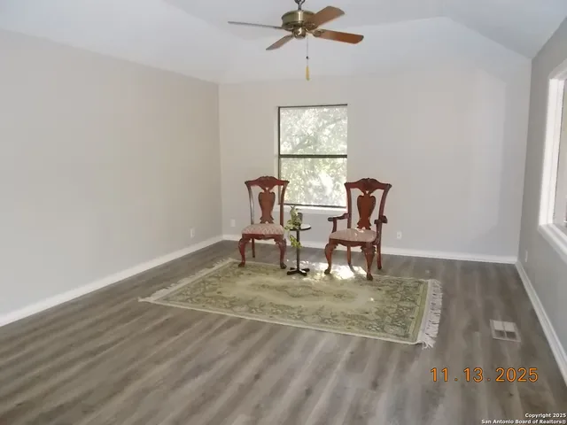 a kitchen with stainless steel appliances granite countertop a sink a window and a refrigerator